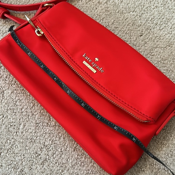 Kate Spade Red cross body purse. Fold over flap style. Zip pocket on front. - Picture 12 of 14